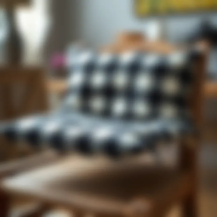Close-up of a black and white checked chair pad placed on a rustic wooden chair