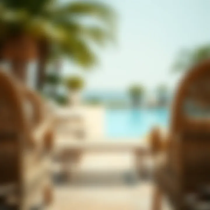 Elegant wicker outdoor chairs arranged by a poolside