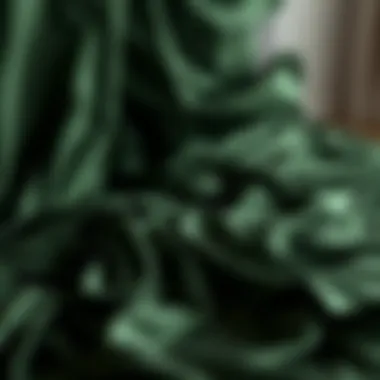 Luxurious dark green satin sheets draping elegantly over a bed