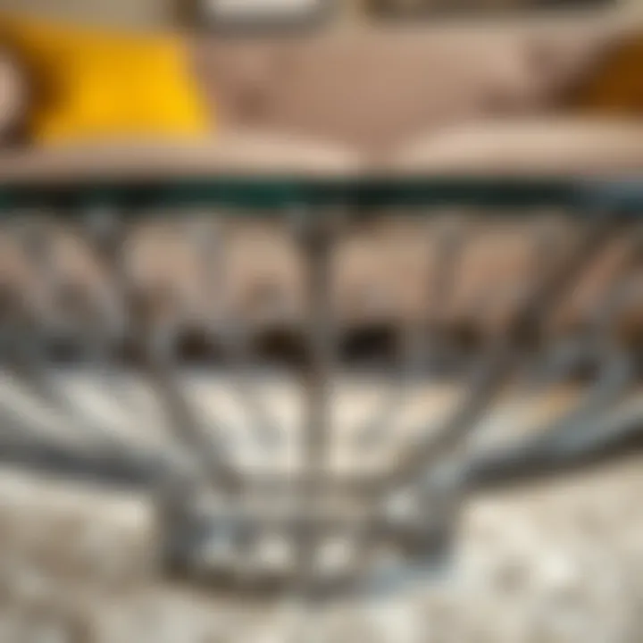 Close-up view of the intricate metal base design of a glass top coffee table