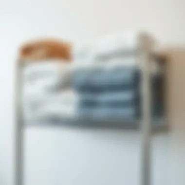 Organized towels arranged on a chrome train rack shelf